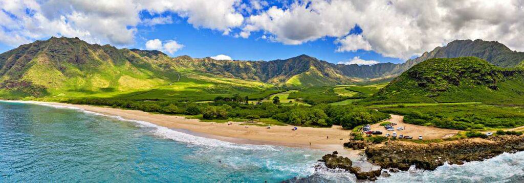 Calm clear waters of Makua Beach are ideal for spotting dolphins in Oahu Hawaii