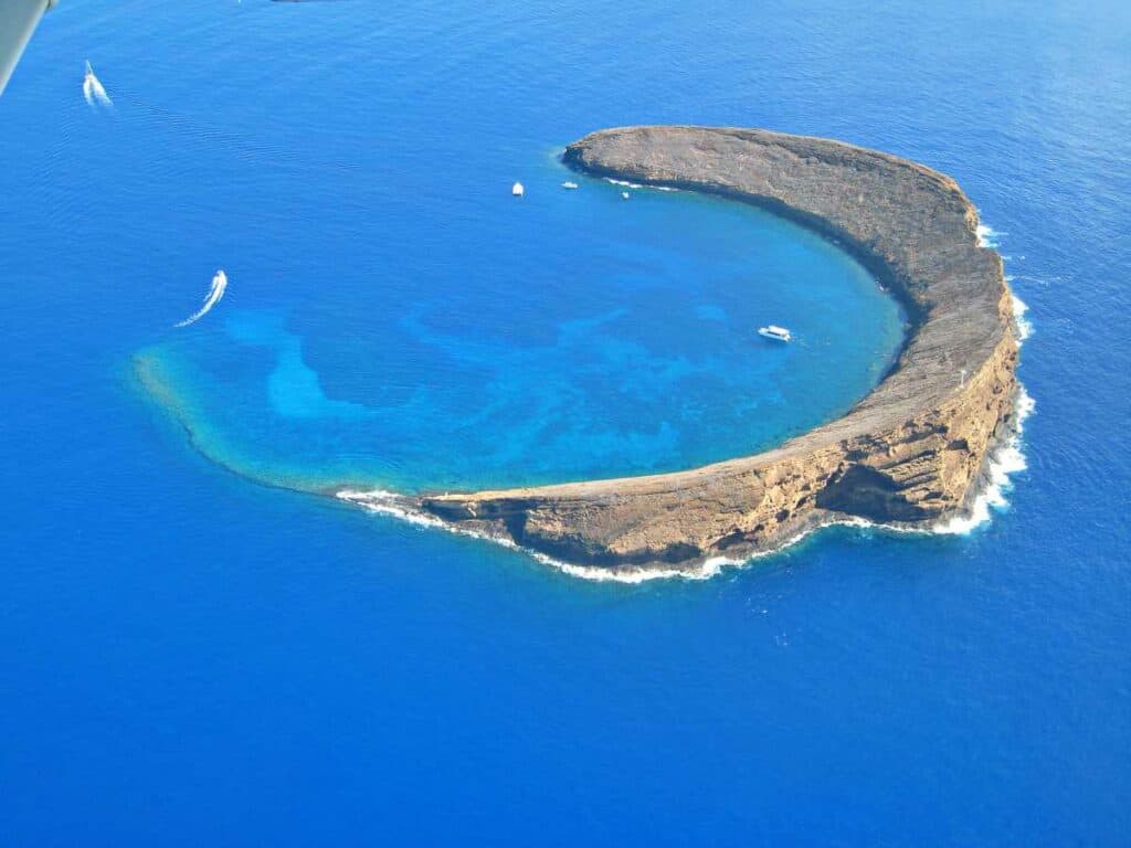 One of the best snorkeling places in Hawaii, Molokini Crater, reachable by boat tours from Lahaina, Maui, Hawaii