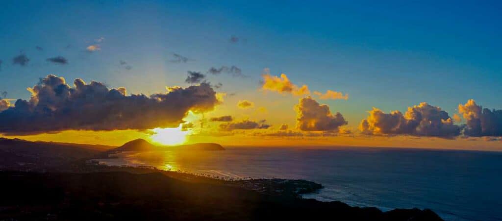 Sun rising over Oahu from top of Diamond Head