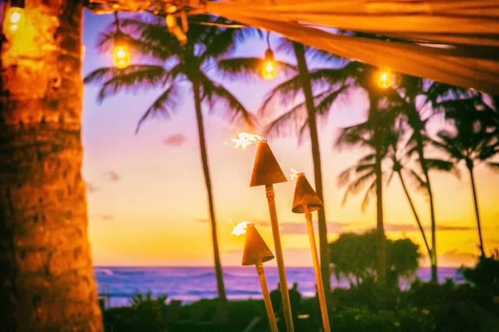 Tiki torches in Hawaii at sunset