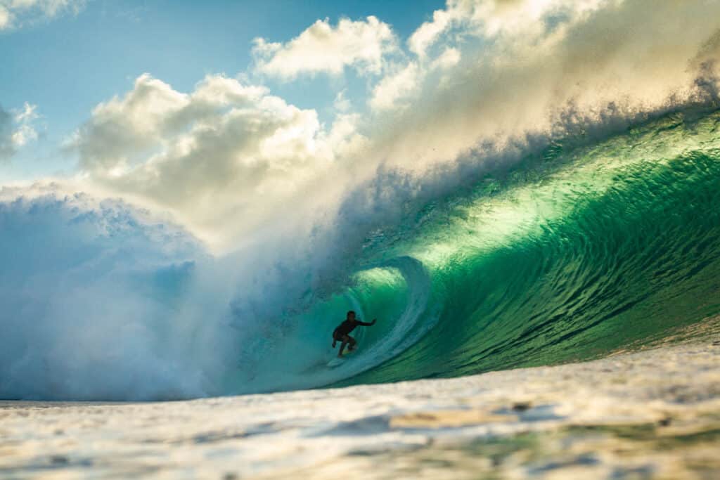 A surfer at the Banzain Pipeline in Oahu, Hawaii