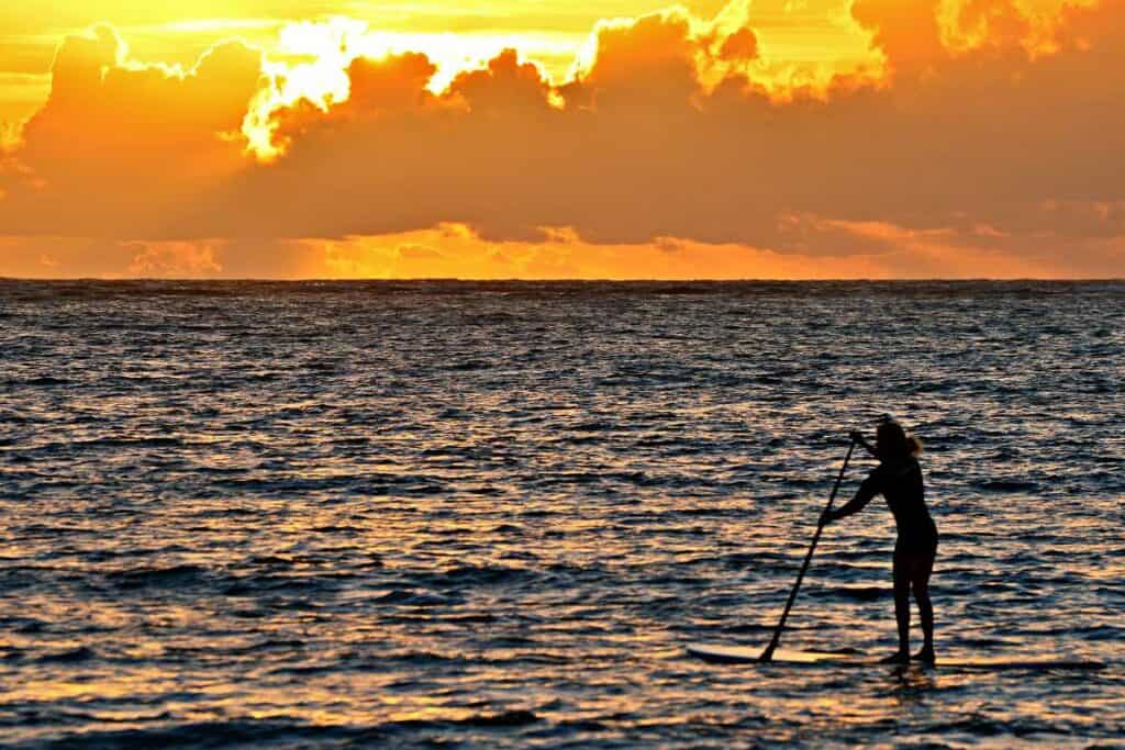 Standup paddle boarding in the calm waters of Hawaii