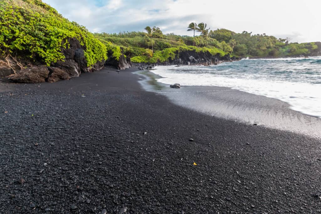 The black sand beach in Waianapanapa State Park in Maui HI