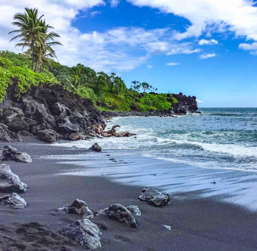Black Sand Beach Maui: Pailoa Beach or Honokalani Beach in Wai'anapanapa State Park near Hana