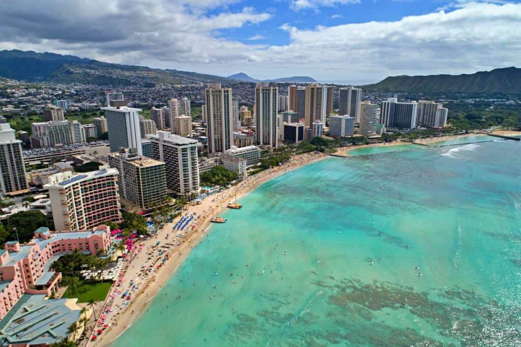 Strolling along Waikiki Beach, one of my favorite free things to do in Waikiki, HI