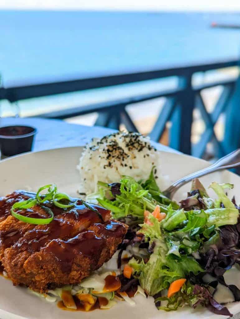Fine dining at a beachfront restaurant, one of the best romantic things to do in Honolulu
