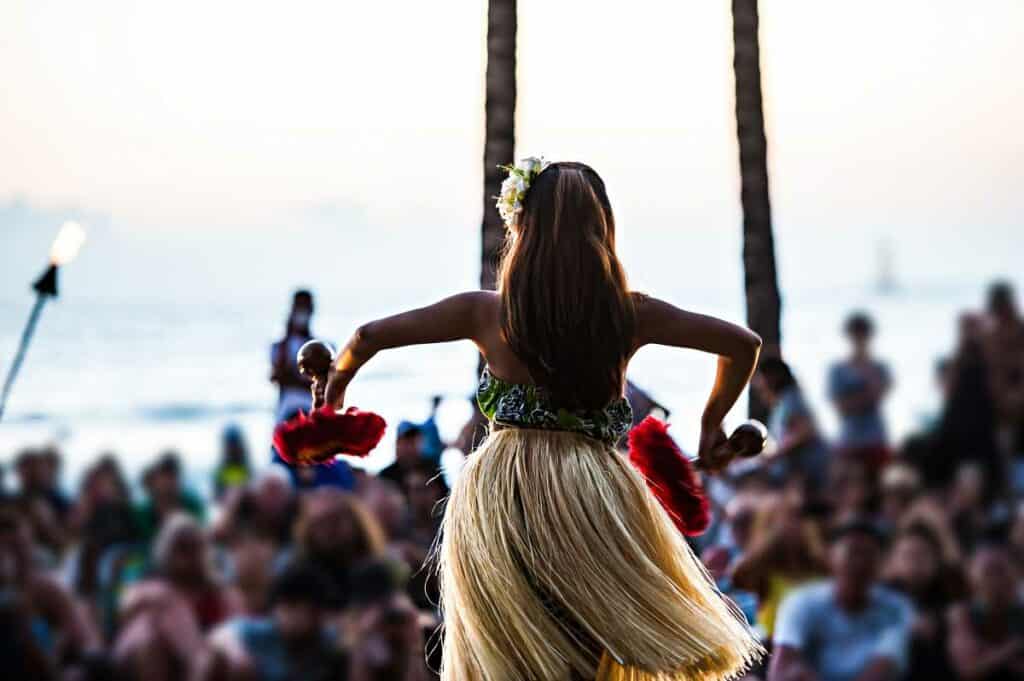 Watching a hula dance on Kuhio Beach, one of the best free things to in Waikiki, Honolulu, Hawaii