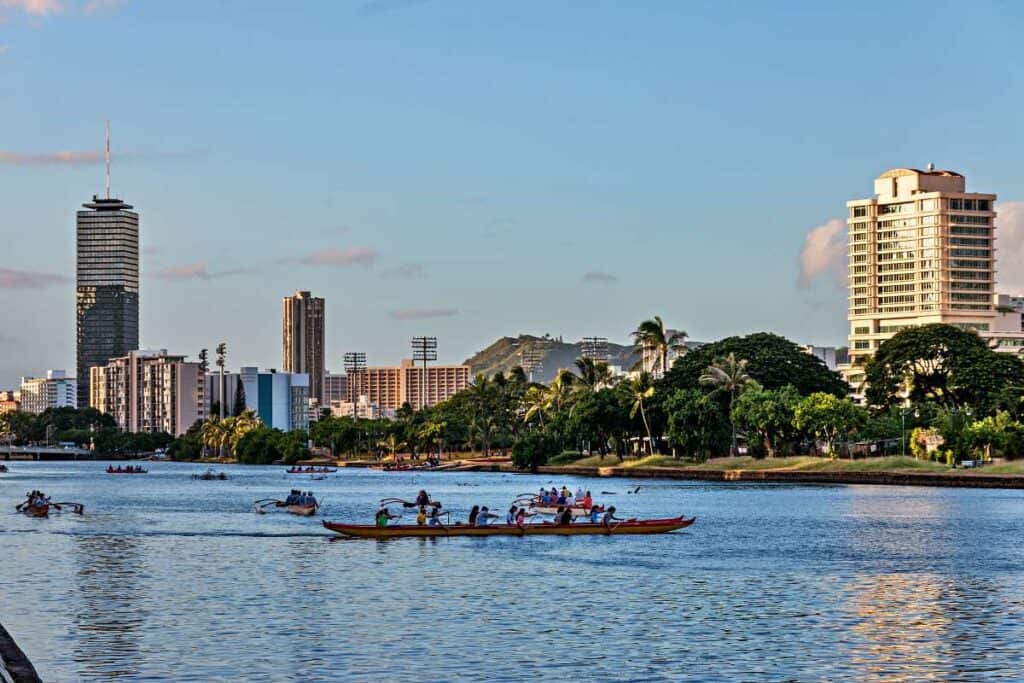 Surf with outrigger canoes: one of the best fun things to do in Waikiki with family
