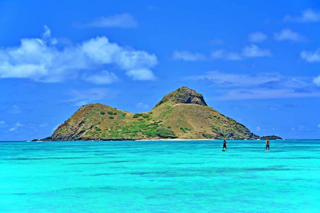 Standup paddleboarders returning to Kailua Beach after a trip to the Mokes