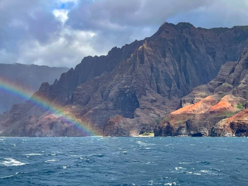 A rainbow over the Na Pali Coast of Kauai Hawaii