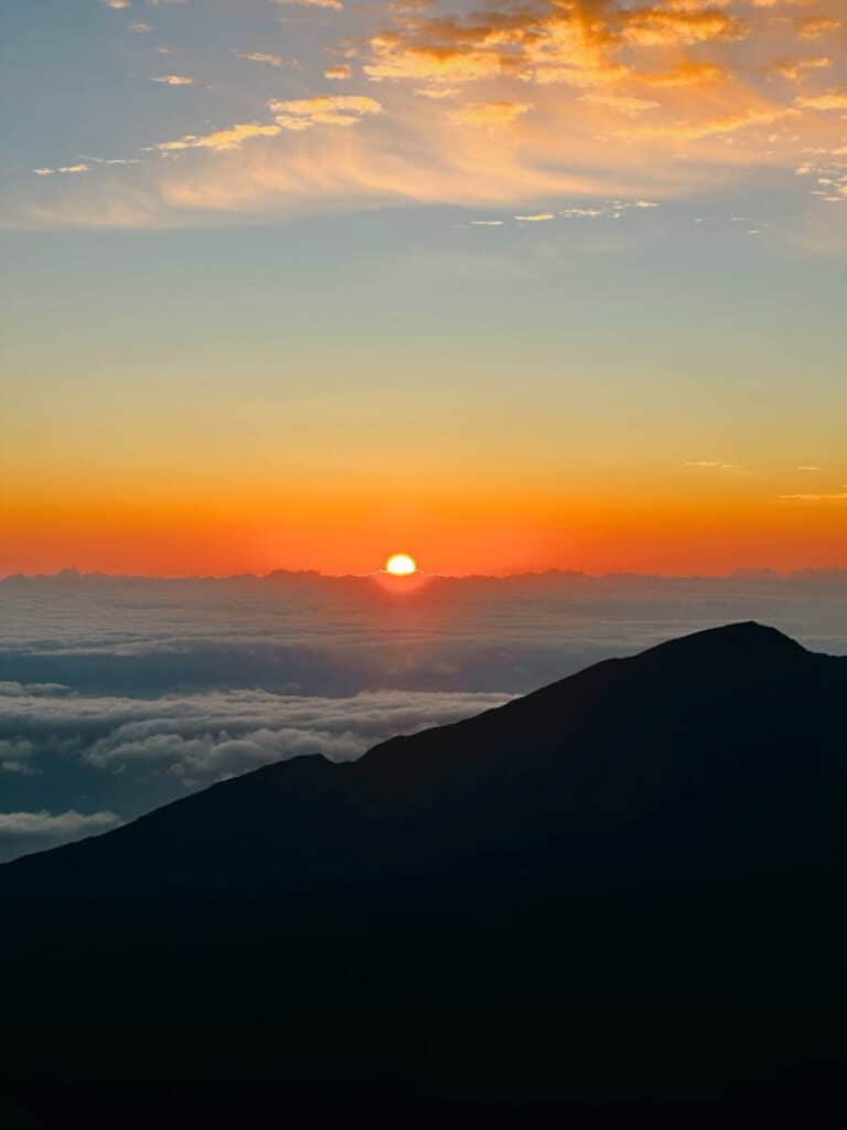The sun rises at Haleakala in Maui, Hawaii