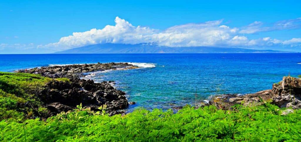 Namalu Bay along the Kapalua Coastal Trail in West Maui, Hawaii, with a view of Molokai island 