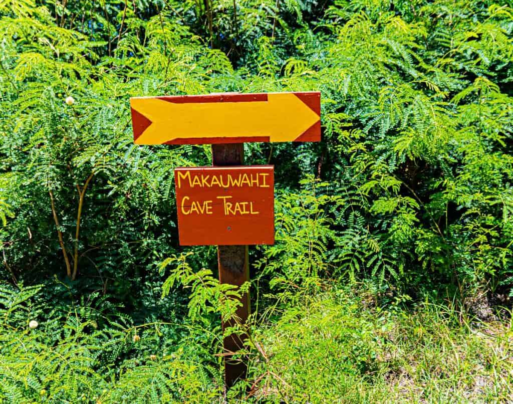 Sign pointing to the Makauwahi Cave Reserve, Mahaulepu Heritage Trail, Poipu, Kauai, Hawaii, USA