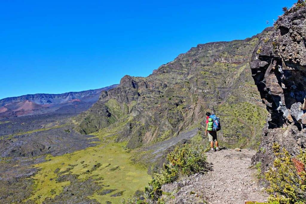 Hiker admiring the view from the Halemau'u Trail return from the Sliding Sands  Trail, Haleakala, Maui