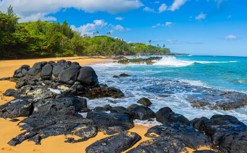 Exposed lava rocks on Secret Beach, Kauai, HI