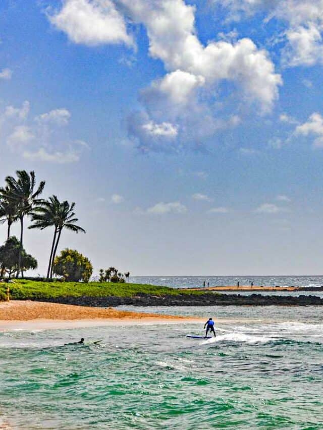 Beautiful Poipu Beach, one of the best Kauai surfing beaches for families with kids and beginners