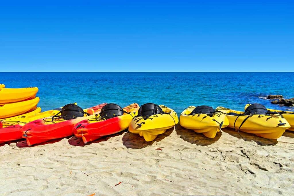 Kayaks on the beach during a break
