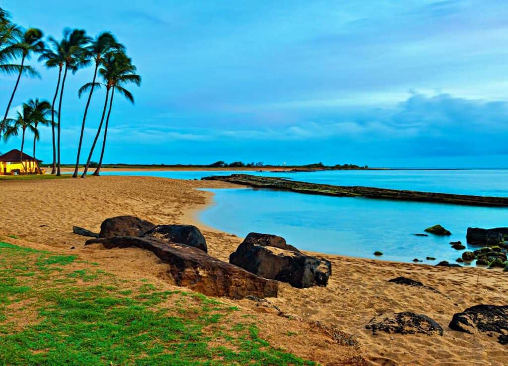 Keiki pond at Salt Pond Beach Park, shallow, calm waters protected by fringing reefs