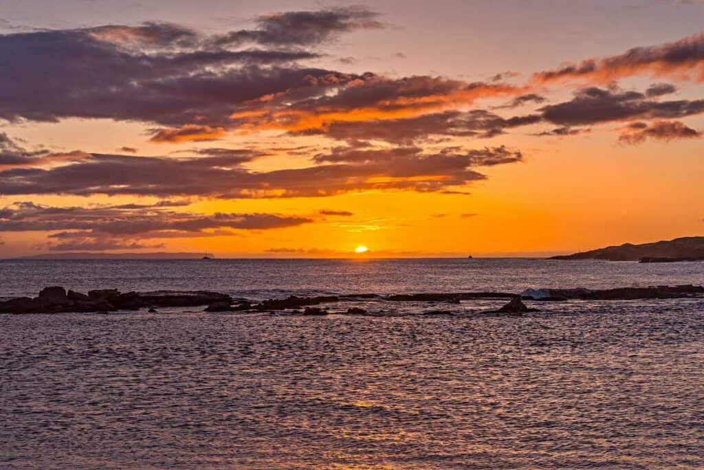 Watch colorful sunsets from Salt Pond Beach Park, Kauai, Hawaii