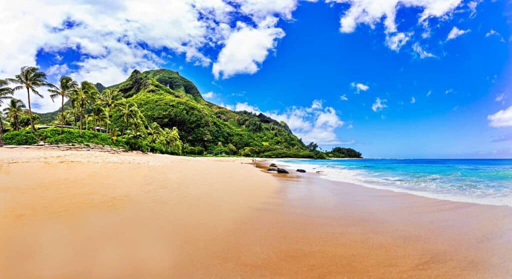 Tunnels Beach, Kauai: Beautiful, wide golden beach, turquoise blue waters, and lush green mountains