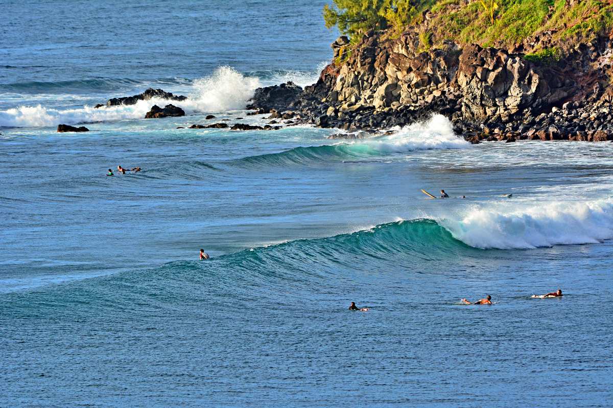 Surfers at Honolua Bay, famous winter surfing spot in Maui