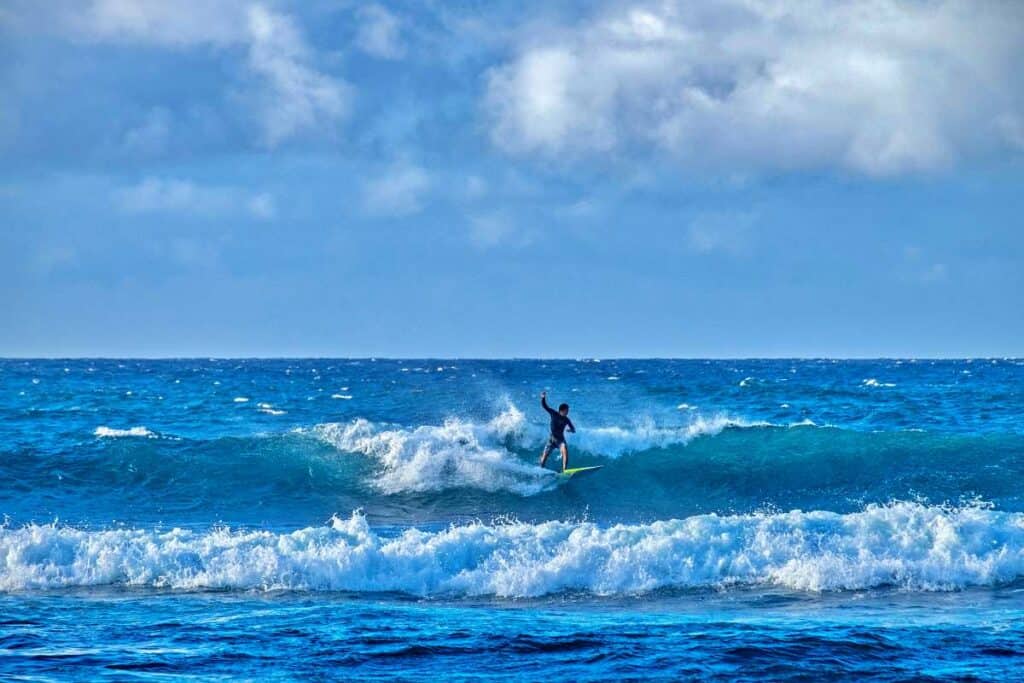 Surfing the large waves at Ho'okipa Beach, Maui, HI
