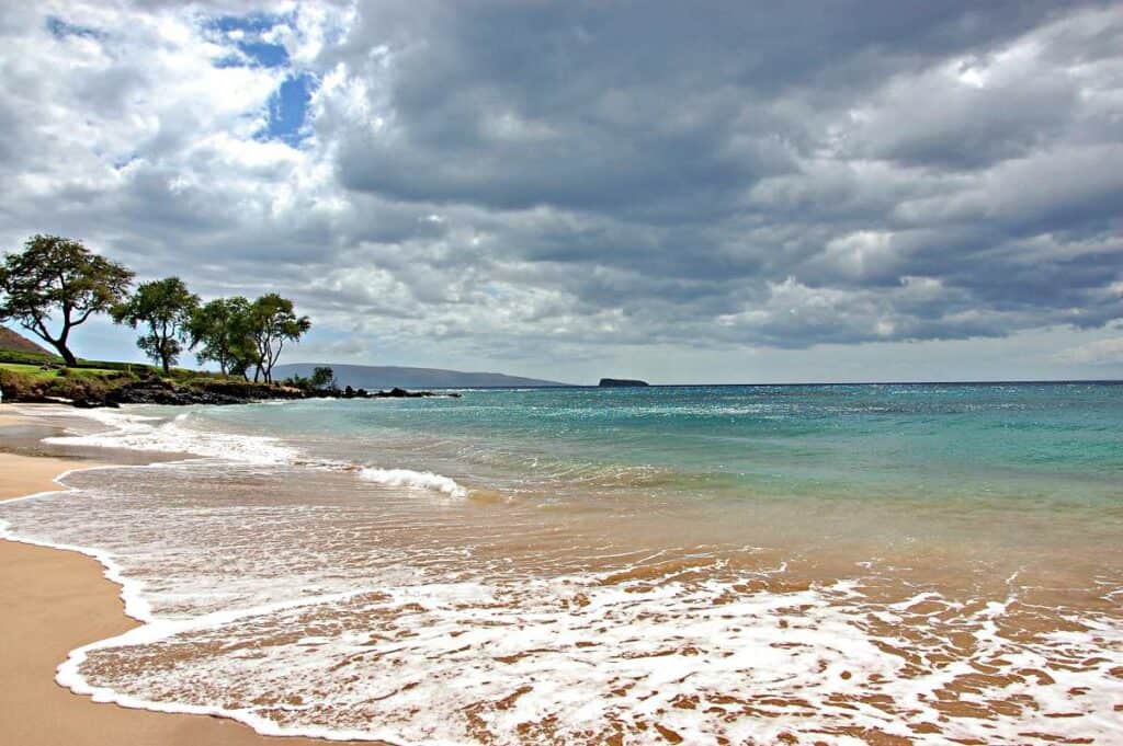 Calm, shallow waters providing a giant natural swimming pool in front of Maluaka Beach, Maui, HI