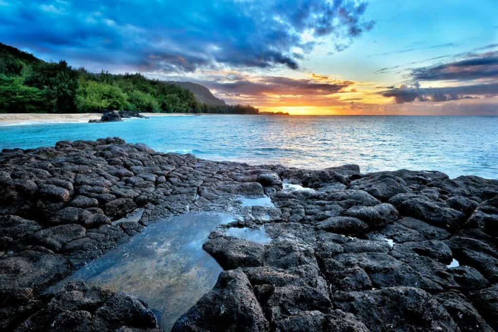 Spectacular, colorful sunset from Secret Beach, Kauai, HI