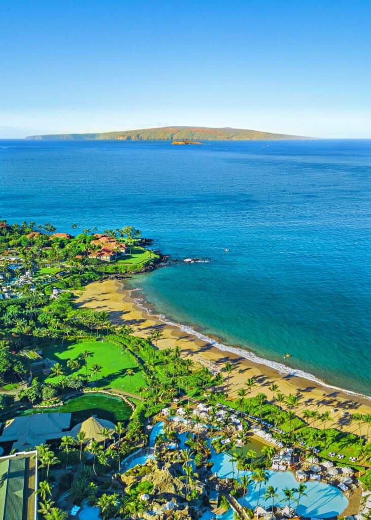 Stunning Wailea Beach with golden sands, clear blue waters, and ritzy resorts