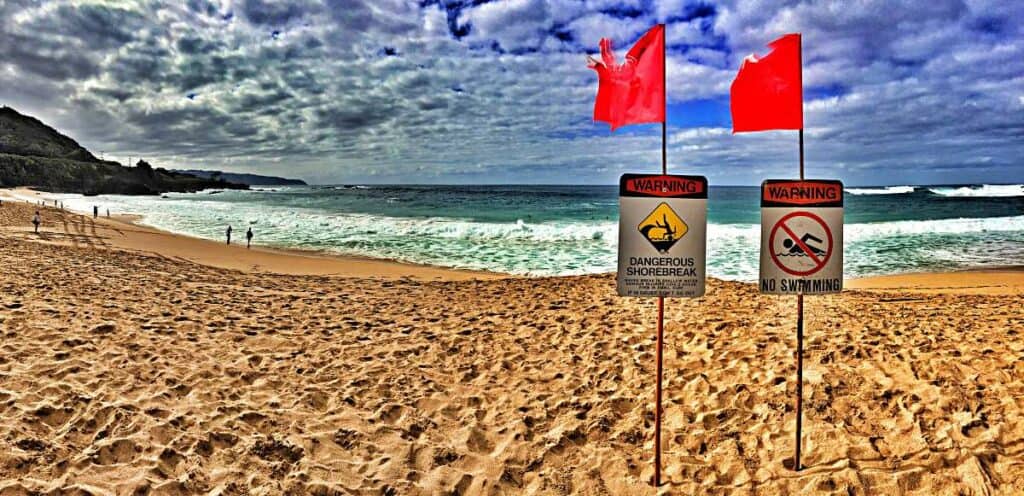 Warning signs at Sunset Beach during the winter months