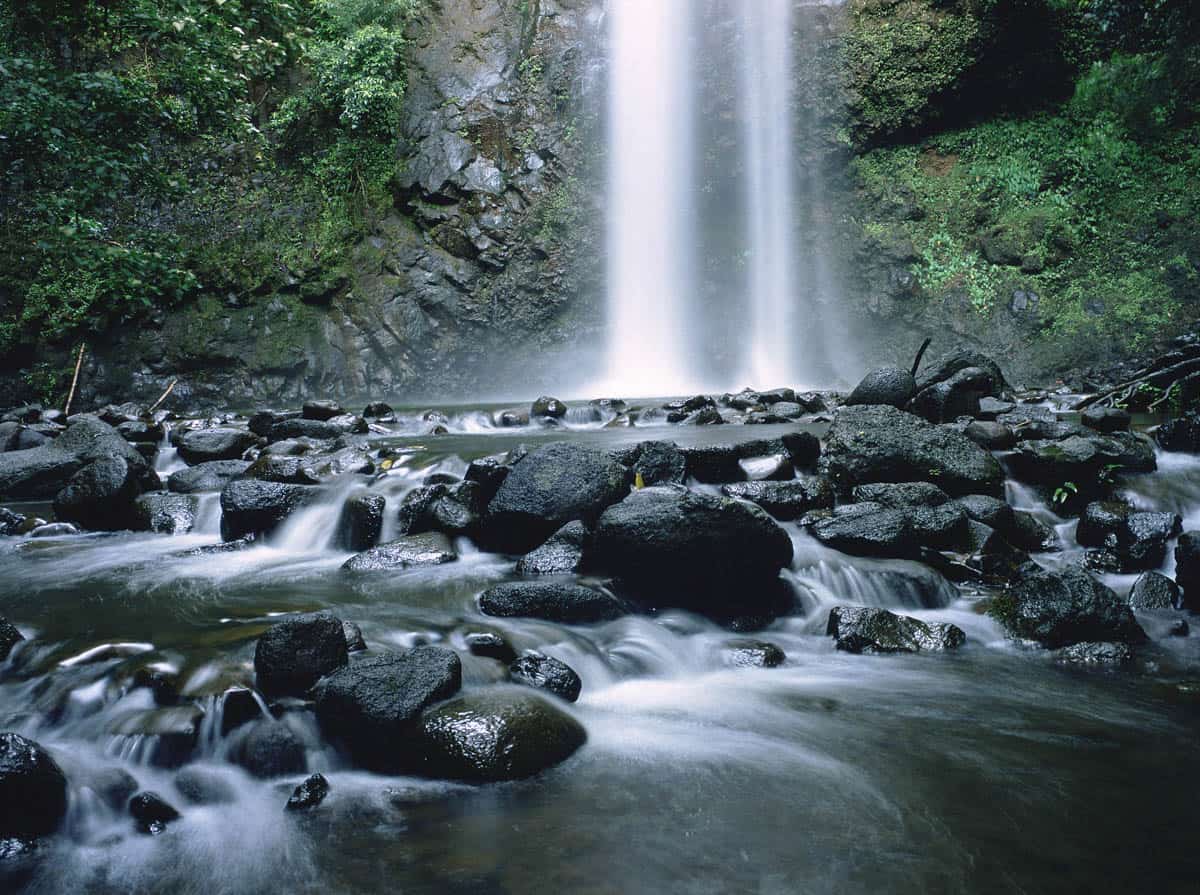 Secret Falls Kauai, accessed by kayaking the Wailua River and hiking through the rainforest.