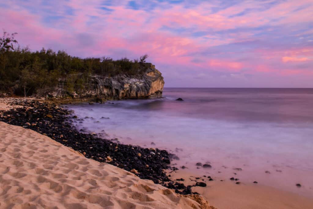 Sunset at Shipwreck Beach, one of the best south shore beaches in Kauai, Hawaii