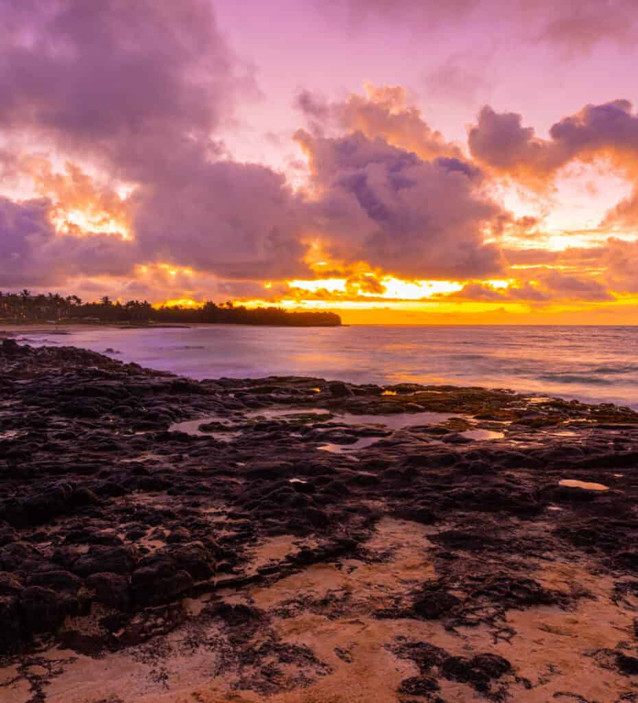 Sunrise at Shipwreck Beach, one of the most beautiful beaches on the south shore of Kauai, Hawaii