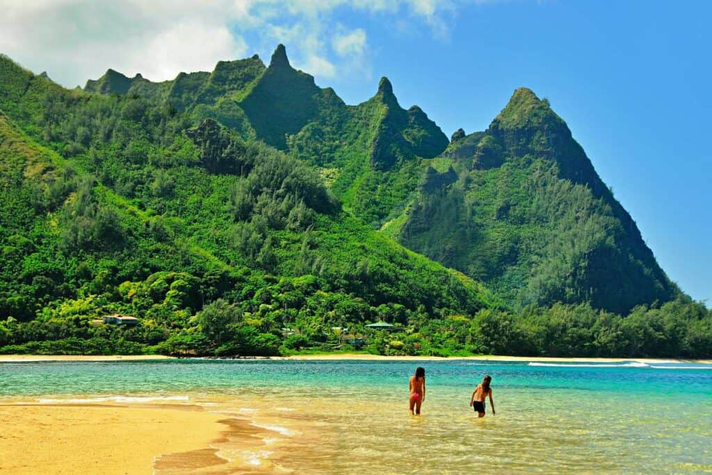 One of the most beautiful beaches in Kauai, Haena Beach is set against a stunning mountain backdrop