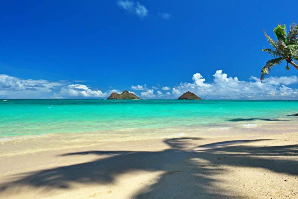 Mokula Islands across stunning blue ocean waters from beautiful Lanikai Beach