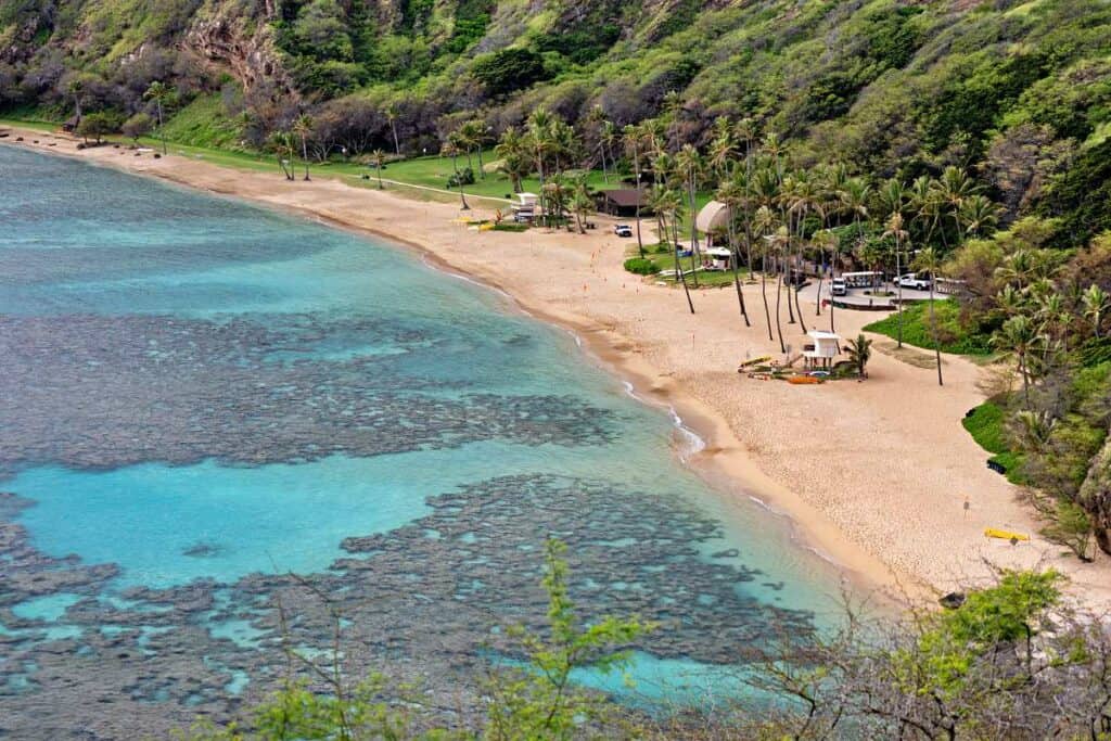 Clear waters, extensive coral reefs, and sandy beach at Hanauma Bay, Honolulu, Hawaii