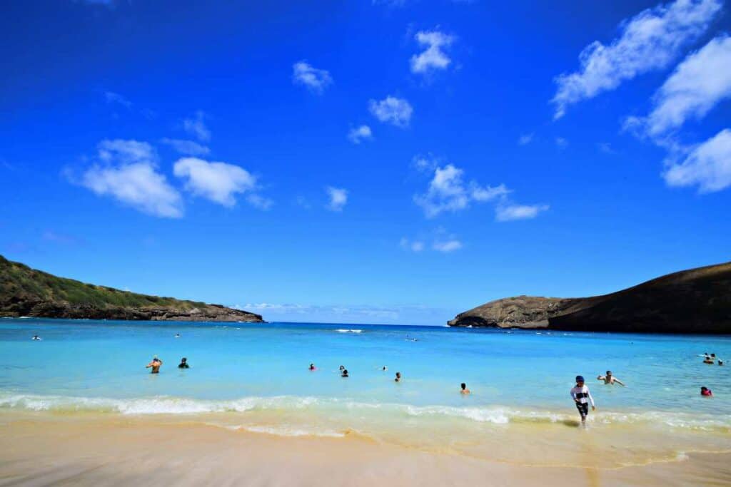 Swimmers and snorkelers in the warm, clear ocean waters of Hanauma Bay, Oahu, HI