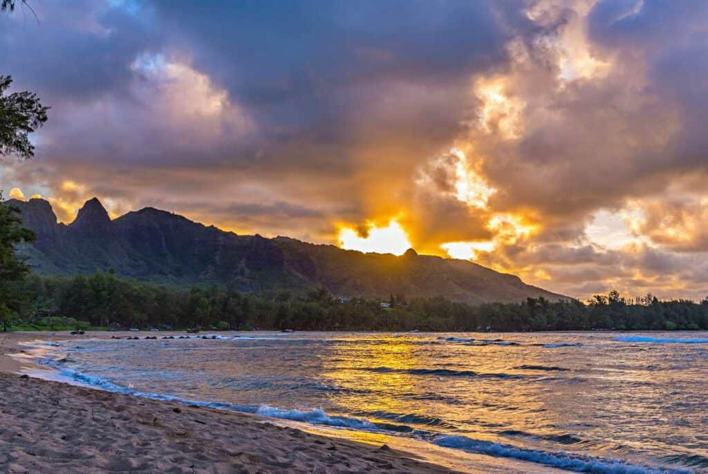 Colorful sunset over the Kalalea mountains from the Anahola Beach, Kauai